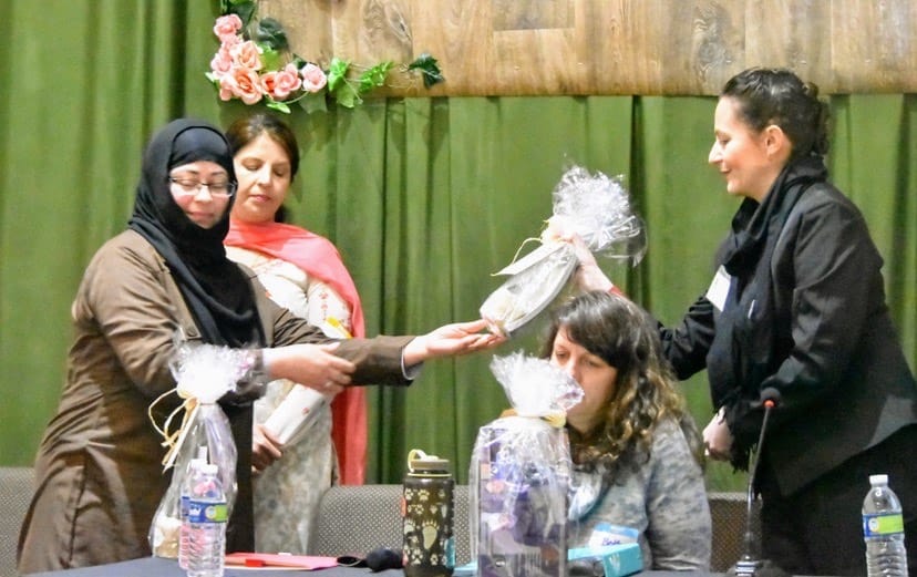 AMWA Peace_Laura Friedman full black receiving from Mehmooda Rehman.jpg